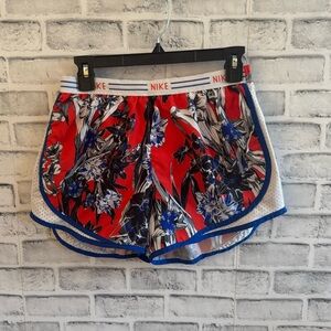 Women’s Nike Dri-fit Orange blue and white floral print lined athletic shorts M